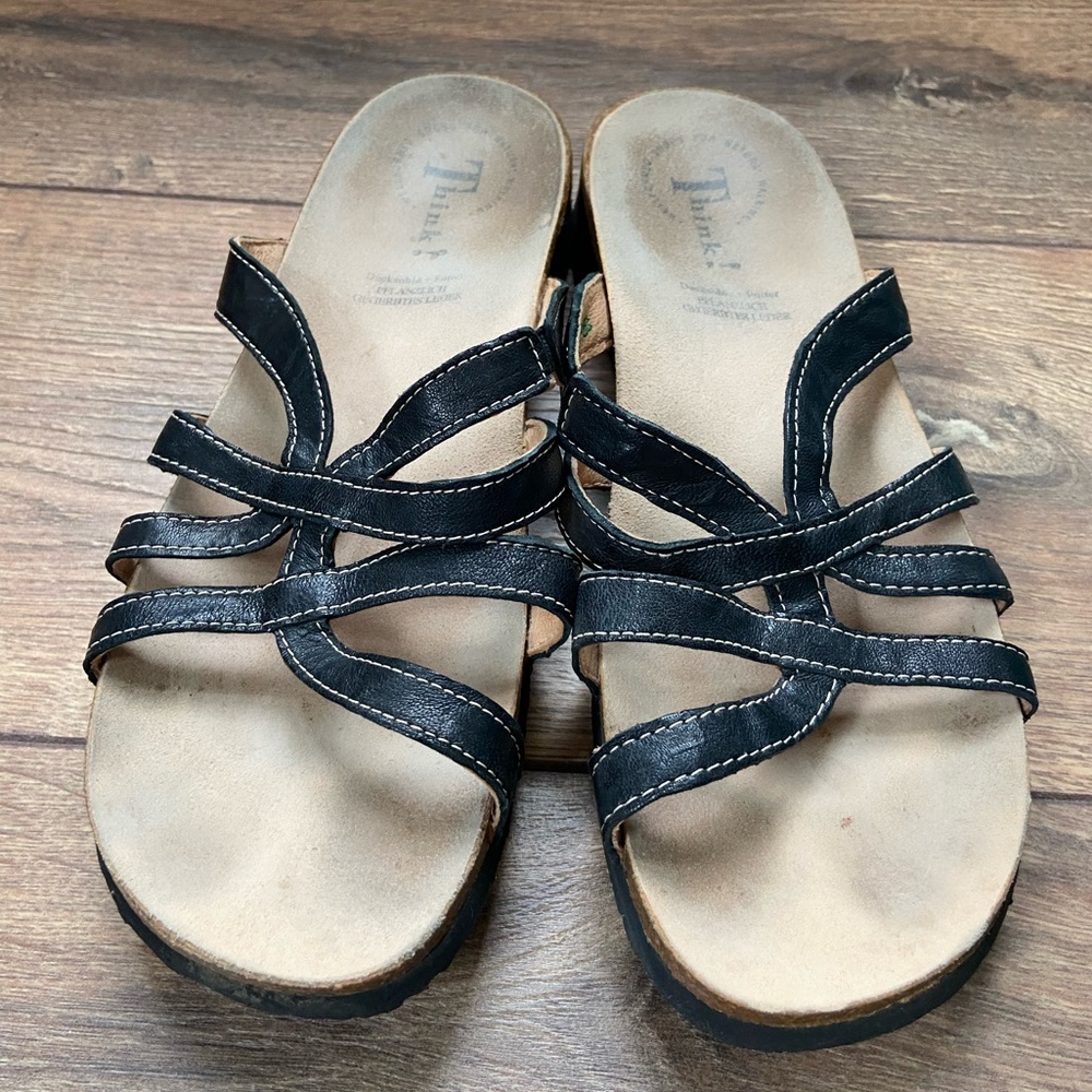 Think! Women’s Slip-On Black Leather Sandals.